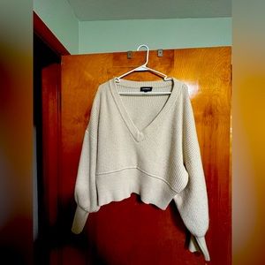 White sweater crop top with deep V-neck